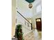 Stunning foyer with hardwood floors, a statement light fixture, and a grand staircase, making a memorable first impression at 2870 Willow Wisp Way, Cumming, GA 30040