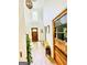 Bright foyer with hardwood floors, a decorative bench, and a clear view of the front door, adding character and charm at 2870 Willow Wisp Way, Cumming, GA 30040