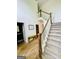 Lovely foyer featuring hardwood floors, staircase, and a decorative bench for a stylish and functional space at 2870 Willow Wisp Way, Cumming, GA 30040