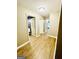 Hallway with wood flooring and multiple doorways at 2870 Willow Wisp Way, Cumming, GA 30040