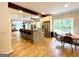 Updated kitchen with stainless steel appliances, an island with seating, and a dining area at 2870 Willow Wisp Way, Cumming, GA 30040
