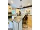 A spacious kitchen with granite countertops, an island cooktop, and modern pendant lighting at 2870 Willow Wisp Way, Cumming, GA 30040