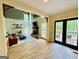 Bright living room featuring a fireplace, wood floors, and large windows overlooking a private deck at 2870 Willow Wisp Way, Cumming, GA 30040