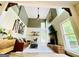 Inviting living room with a ceiling fan, fireplace, vaulted ceilings, wood floors, and an area rug at 2870 Willow Wisp Way, Cumming, GA 30040