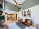 Open living room with a ceiling fan, neutral paint colors, and a partial view of the kitchen at 2870 Willow Wisp Way, Cumming, GA 30040