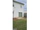 An exterior shot of the backyard with a concrete patio and grass at 2867 Snapfinger Mnr, Decatur, GA 30035