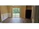 Dining room features a sliding glass door, wood-look floors, and chair railing at 2867 Snapfinger Mnr, Decatur, GA 30035