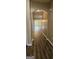 Hallway features arched entryway, wood-look flooring, and neutral wall color at 2867 Snapfinger Mnr, Decatur, GA 30035