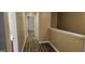 Hallway with wood look floors and access to bedrooms and bathroom at 2867 Snapfinger Mnr, Decatur, GA 30035