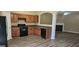 Kitchen featuring dark appliances, wood cabinets and hard surface flooring at 2867 Snapfinger Mnr, Decatur, GA 30035