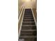 Carpeted staircase leading to upper level of home at 2867 Snapfinger Mnr, Decatur, GA 30035