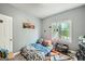 bedroom featuring a large window, playful decor, and carpeted floors at 5640 Rolling Oaks Dr, Cumming, GA 30040