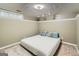 Carpeted bedroom with light colors, ample lighting, and a large bed at 5640 Rolling Oaks Dr, Cumming, GA 30040