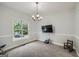 Bright dining room featuring plush carpeting and ample space for entertaining at 5640 Rolling Oaks Dr, Cumming, GA 30040