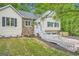 Charming split level home featuring stone accents, white trim, and a two-car garage at 5640 Rolling Oaks Dr, Cumming, GA 30040