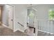 Open foyer with tile flooring, white trim, and natural light cascading through the front door at 5640 Rolling Oaks Dr, Cumming, GA 30040