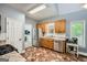 Functional kitchen with wood cabinets, stainless steel appliances, and patterned tile flooring at 5640 Rolling Oaks Dr, Cumming, GA 30040