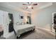 Carpeted main bedroom with a trey ceiling, neutral colors, and side tables at 5640 Rolling Oaks Dr, Cumming, GA 30040