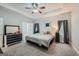 Spacious main bedroom with trey ceiling, neutral colors, and carpeted floors at 5640 Rolling Oaks Dr, Cumming, GA 30040