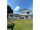 Backyard showcasing a grassy lawn, patio, and a two-story home at 732 Sandhill Shady Grove Rd, Carrollton, GA 30116
