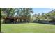 Expansive backyard featuring lush green lawn and covered storage area at 732 Sandhill Shady Grove Rd, Carrollton, GA 30116