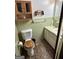 A quaint bathroom features a sink, tile walls, a toilet, and a vintage tile floor at 732 Sandhill Shady Grove Rd, Carrollton, GA 30116