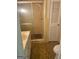 Cozy bathroom featuring a shower, vanity, and a vintage tile floor at 732 Sandhill Shady Grove Rd, Carrollton, GA 30116