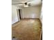 Clean bedroom with neutral walls, carpet flooring, and a ceiling fan at 732 Sandhill Shady Grove Rd, Carrollton, GA 30116