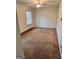 Standard bedroom featuring neutral walls, carpet flooring, and a window at 732 Sandhill Shady Grove Rd, Carrollton, GA 30116