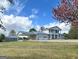 Inviting two-story home with a steel roof, covered parking, and charming curb appeal at 732 Sandhill Shady Grove Rd, Carrollton, GA 30116