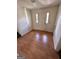 Inviting foyer with a white front door and beautiful laminate flooring at 732 Sandhill Shady Grove Rd, Carrollton, GA 30116