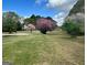 Expansive lawn featuring blooming trees in a serene setting at 732 Sandhill Shady Grove Rd, Carrollton, GA 30116