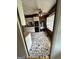 Vintage kitchen featuring white cabinets, black appliances, and unique stone-look flooring at 732 Sandhill Shady Grove Rd, Carrollton, GA 30116