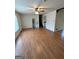Spacious living room featuring neutral walls, laminate flooring, and a ceiling fan at 732 Sandhill Shady Grove Rd, Carrollton, GA 30116