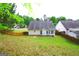 Landscaped backyard with a fence, offering privacy and a peaceful outdoor space for relaxation at 25 Pacific Ave, Sharpsburg, GA 30277