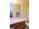 Traditional bathroom with pink-toned vanity, neutral walls, and patterned shower curtain at 25 Pacific Ave, Sharpsburg, GA 30277