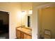 Bathroom featuring a double vanity with wooden cabinets and a separate toilet room at 25 Pacific Ave, Sharpsburg, GA 30277
