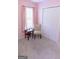 Bedroom with carpet flooring, features a window and a closet with bi-fold doors at 25 Pacific Ave, Sharpsburg, GA 30277