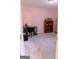 Bright pink bedroom with desk, bookcase and soft neutral carpet at 25 Pacific Ave, Sharpsburg, GA 30277