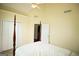Bedroom with a four-poster bed, double closets, and a vaulted ceiling at 25 Pacific Ave, Sharpsburg, GA 30277