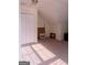 Attic bonus room with carpeting, natural light, closet, and sloped ceilings at 25 Pacific Ave, Sharpsburg, GA 30277