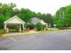 Community pool and clubhouse with parking, offering recreational amenities and a gathering space for residents at 25 Pacific Ave, Sharpsburg, GA 30277