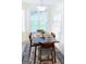 Bright breakfast nook with modern chandelier and table setting at 25 Pacific Ave, Sharpsburg, GA 30277