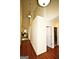 Bright hallway featuring hardwood floors, light walls, and modern lighting fixtures at 25 Pacific Ave, Sharpsburg, GA 30277