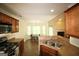 Traditional kitchen with stainless steel appliances, tile floor, breakfast nook, and open concept view of the living room at 25 Pacific Ave, Sharpsburg, GA 30277