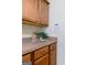 This kitchen features wooden cabinets and drawers and a light countertop at 25 Pacific Ave, Sharpsburg, GA 30277