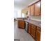 This kitchen features wooden cabinets, stainless steel appliances, and a breakfast bar overlooking an eat-in dining area at 25 Pacific Ave, Sharpsburg, GA 30277