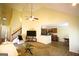 Spacious living area with vaulted ceilings, a cozy seating area, and a kitchen view at 25 Pacific Ave, Sharpsburg, GA 30277