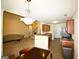 Open concept living and kitchen with a ceiling fan, and ample dining space at 25 Pacific Ave, Sharpsburg, GA 30277