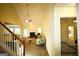 Open living room with high ceilings, fireplace, and large windows offering natural light at 25 Pacific Ave, Sharpsburg, GA 30277